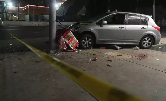 An area is roped off after a vehicle rammed into a crowd of people waiting to enter a nightclub along a busy boulevard in Los Angeles early Saturday, July 19, 2025, injuring several people. (AP Photo/Damian Dovarganes)