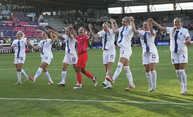 Finland players celebrate after the Euro 2025, group A, soccer match between Iceland and Finland at Arena Thun in Thun, Switzerland, Wednesday, July 2, 2025. (AP Photo/Alessandra Tarantino)