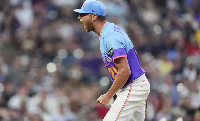 Colorado Rockies starting pitcher Kyle Freeland reacts after striking out Minnesota Twins' Brooks Lee to end the top of the sixth inning of a baseball game Friday, July 18, 2025, in Denver. (AP Photo/David Zalubowski)