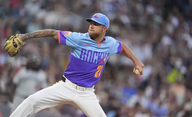 Colorado Rockies starting pitcher Kyle Freeland works against the Minnesota Twins in the sixth inning of a baseball game Friday, July 18, 2025, in Denver. (AP Photo/David Zalubowski)