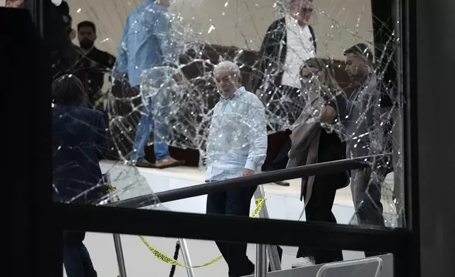 FILE - Brazil's President Luiz Inacio Lula da Silva surveys the damage at the Planalto Palace after it was stormed by supporters of former President Jair Bolsonaro, in Brasilia, Brazil, Jan. 8, 2023. (AP Photo/Eraldo Peres, File)