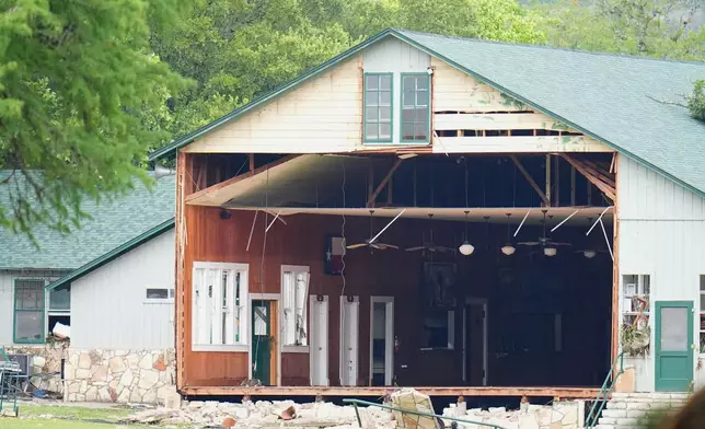 A wall is missing on a building at Camp Mystic along the banks of the Guadalupe River after a flash flood swept through the area Saturday, July 5, 2025, in Hunt, Texas. (AP Photo/Julio Cortez)