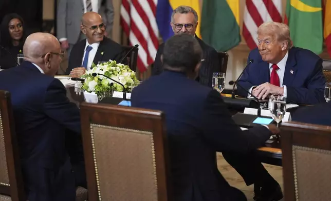 President Donald Trump speaks with African leaders including Senegalese President Bassirou Diomaye Faye, Liberian President Joseph Nyuma Boakai, Bissau-Guinean President Umaro Sissoco EmbalÛ, Mauritanian President Mohamed Ould Ghazouani and Gabonese President Brice Oligui Nguema during a lunch in the State Dining Room of the White House, Wednesday, July 9, 2025, in Washington. (AP Photo/Evan Vucci)