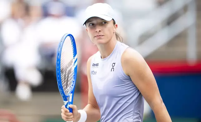 Iga Swiatek, of Poland, celebrates after defeating Guo Hanyu, of China, during second round tennis at the National Bank Open tennis tournament in Montreal on Wednesday, July 30, 2025. (Christopher Katsarov/The Canadian Press via AP)
