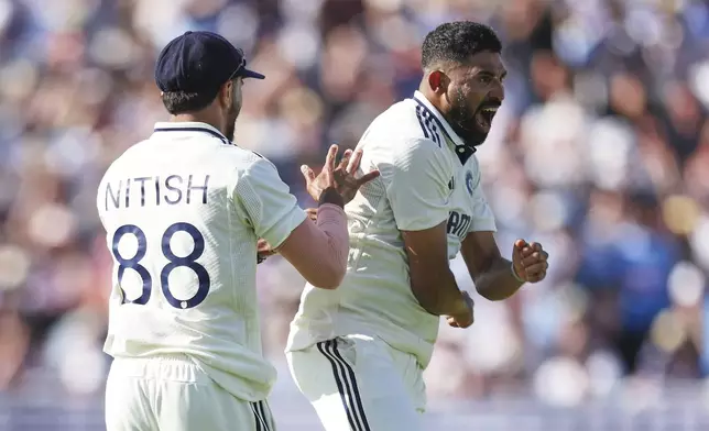 India's Mohammed Siraj, right, celebrates after the dismissal of England's Zak Crawley on day two of the second cricket test match between England and India at Edgbaston in Birmingham, England, Thursday, July 3, 2025. (AP Photo/Scott Heppell)