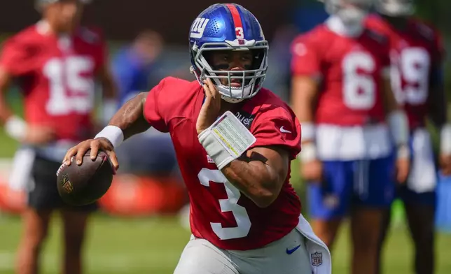 New York Giants quarterback Russell Wilson (3) looks to throw during practice at the team’s NFL football training camp in East Rutherford, N.J., Wednesday, July 23, 2025. (AP Photo/Yuki Iwamura)
