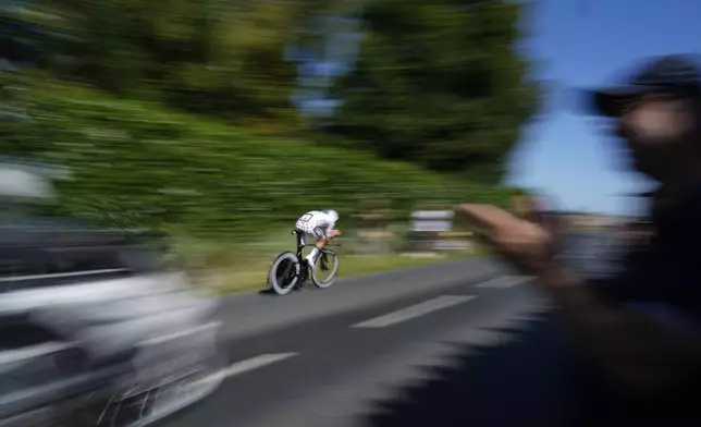 Slovenia's Tadej Pogacar wearing the best climber's dotted jersey competes during the fifth stage of the Tour de France cycling race, an indivdual time-trial over 33 kilometers (20.5 miles) with start and finish in Caen, France, Wednesday, July 9, 2025. (AP Photo/Mosa'ab Elshamy)