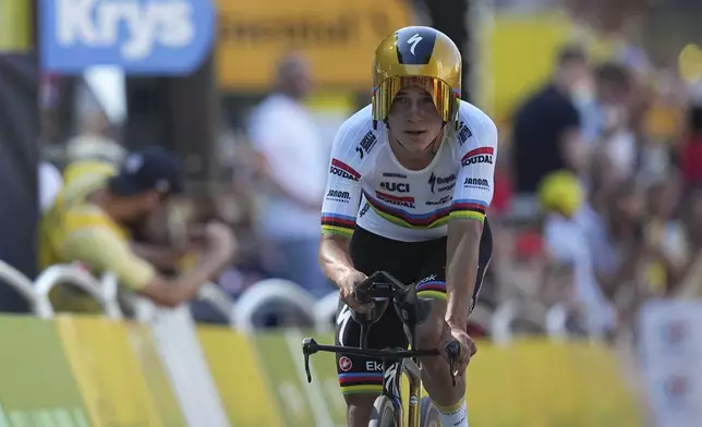 Belgium's Remco Evenepoel crosses the finish line during the fifth stage of the Tour de France cycling race, an indivdual time-trial over 33 kilometers (20.5 miles) with start and finish in Caen, France, Wednesday, July 9, 2025. (AP Photo/Thibault Camus)