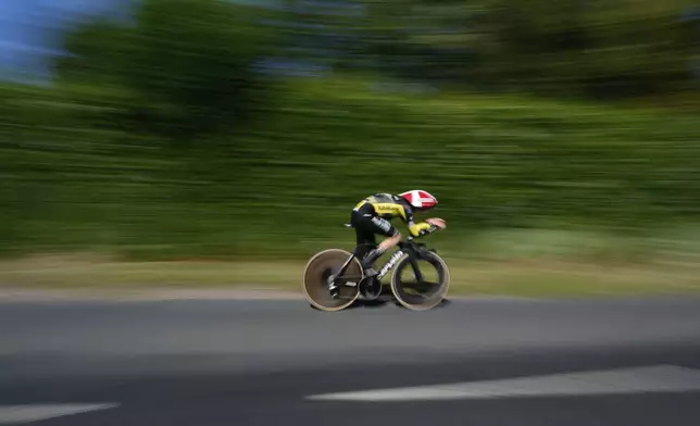 Denmark's Jonas Vingegaard competes during the fifth stage of the Tour de France cycling race, an indivdual time-trial over 33 kilometers (20.5 miles) with start and finish in Caen, France, Wednesday, July 9, 2025. (AP Photo/Mosa'ab Elshamy)