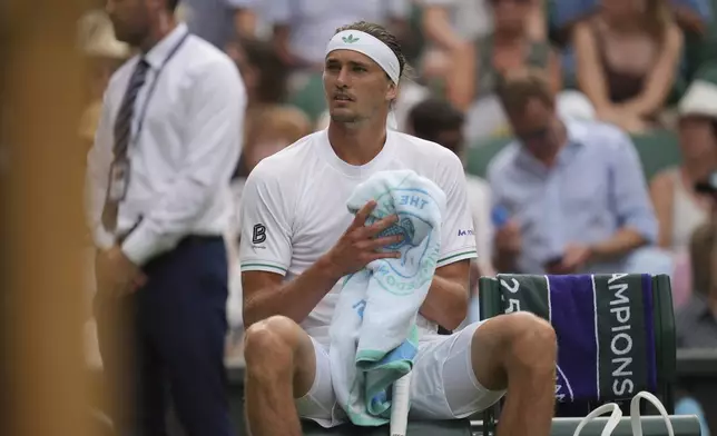 Alexander Zverev of Germany reacts as he plays Arthur Rinderknech of France during their first round men's singles match at the Wimbledon Tennis Championships in London, Tuesday, July 1, 2025. (AP Photo/Kin Cheung)