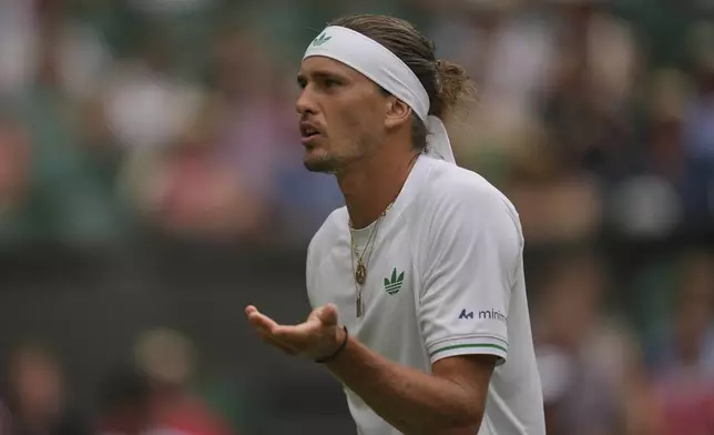 Alexander Zverev of Germany reacts as he plays Arthur Rinderknech of France during their first round men's singles match at the Wimbledon Tennis Championships in London, Tuesday, July 1, 2025. (AP Photo/Kin Cheung)