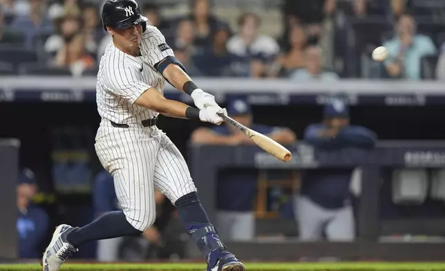 New York Yankees' Anthony Volpe hits a home run during the ninth inning of a baseball game against the Tampa Bay Rays Wednesday, July 30, 2025, in New York. (AP Photo/Frank Franklin II)