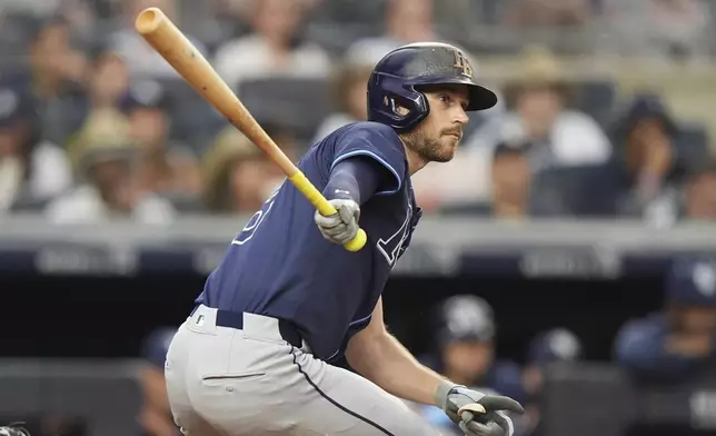 Tampa Bay Rays' Brandon Lowe hits an RBI double during the third inning of a baseball game against the New York Yankees Wednesday, July 30, 2025, in New York. (AP Photo/Frank Franklin II)