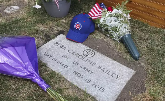 The grave marker of 75-year-old Pfc. Reba C. Bailey, a former missing person cold case named Seven Doe, is seen during a military funeral at Mount Olivet Catholic Cemetery in Chicago, Tuesday, July 1, 2025. (AP Photo/Talia Sprague)