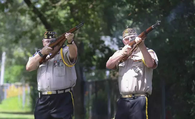 Robert Jensen and Mark Ethridge, right, of the Veterans of Foreign Wars Post 2791, perform a 21-gun salute during a military funeral for 75-year-old Pfc. Reba C. Bailey, a former missing person cold case named Seven Doe, Tuesday, July 1, 2025, at Mount Olivet Catholic Cemetery in Chicago. (AP Photo/Talia Sprague)