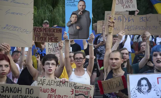 Demonstrators protest against a new bill proposed by President Volodymyr Zelenskyy restoring the independence of the country’s anti-corruption agencies, in Kyiv, Ukraine, Thursday, July 24, 2025. (AP Photo/Efrem Lukatsky)
