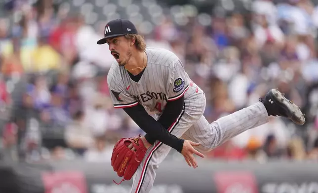 Minnesota Twins starting pitcher Joe Ryan works against the Colorado Rockies in the seventh inning of a baseball game Sunday, July 20, 2025, in Denver. (AP Photo/David Zalubowski)