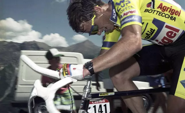 FILE - Cyclist Greg LeMond of the United States is shown in action in the 15th stage of the Tour de France in town of Ocieres, in the French Alps, July 16, 1989. (AP Photo/Lionel Cironneau, File)