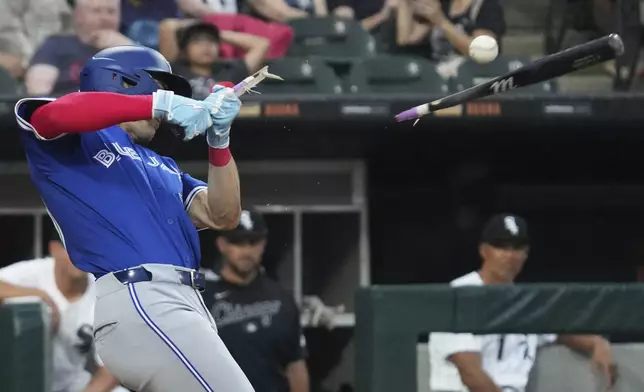 Toronto Blue Jays' Joey Loperfido breaks his bat as he grounds into a force out during the third inning of a baseball game against the Chicago White Sox in Chicago, Tuesday, July 8, 2025. (AP Photo/Nam Y. Huh)
