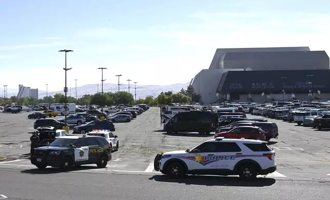 Police respond to a shooting outside the Grand Sierra Resort in Reno, Nev., Monday, July 28, 2025. (AP Photo/Andy Barron)
