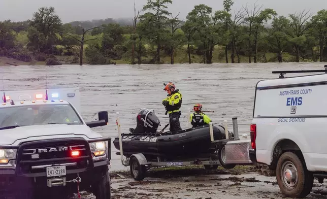 Members of Task Force 1 deploy boats along the Guadalupe River in the wake of a destructive flooding event in Kerrville on Friday July 4, 2025. (Christopher Lee/The San Antonio Express-News via AP)