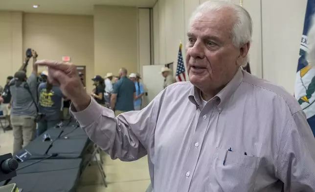 Kerr County Judge Rob Kelly speaks to members of the media following a press conference held by Gov. Greg Abbott discussing the ongoing search and rescue efforts after recent flooding along the Guadalupe River on Saturday, July 5, 2025, in Kerrville, Texas. (AP Photo/Rodolfo Gonzalez)