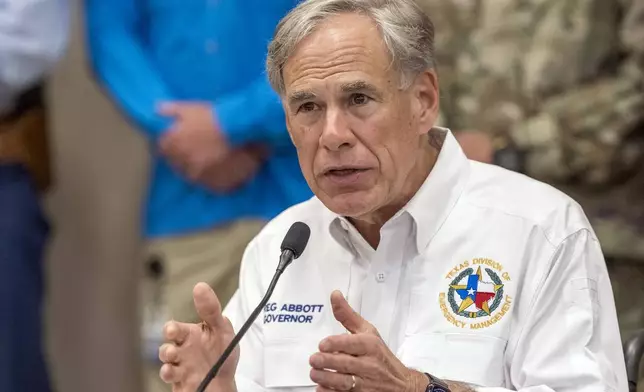 Texas Gov. Greg Abbott discuss the ongoing search and rescue efforts after recent flooding along the Guadalupe River during a press conference on Saturday, July 5, 2025, in Kerrville, Texas. (AP Photo/Rodolfo Gonzalez)