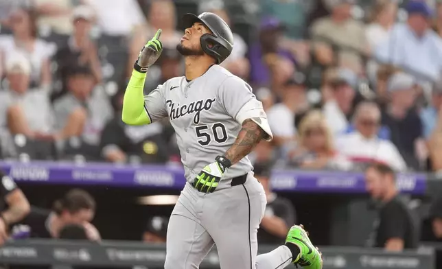 Chicago White Sox's Lenyn Sosa gestures as he circles the bases after hitting a two-run home run off Colorado Rockies starting pitcher Germán Márquez in the second inning of a baseball game Saturday, July 5, 2025, in Denver. (AP Photo/David Zalubowski)