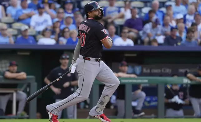 Cleveland Guardians' Johnathan Rodriguez watches his two-run double during the first inning in the second baseball game of a doubleheader against the Kansas City Royals, Saturday, July 26, 2025, in Kansas City, Mo. (AP Photo/Charlie Riedel)