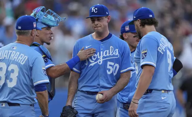 Kansas City Royals starting pitcher Kris Bubic (50) comes out of the game during the third inning in the second baseball game of a doubleheader against the Cleveland Guardians, Saturday, July 26, 2025, in Kansas City, Mo. (AP Photo/Charlie Riedel)
