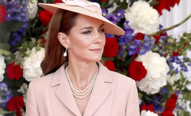 Britain's Kate, Princess of Wales awaits the arrival of France's President Emmanuel Macron and his wife Brigitte Macron in Windsor, England, Tuesday July 8, 2025, on the first day of a three-day state visit to Britain. (Chris Jackson/Pool via AP)