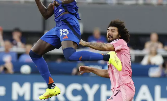 FC Cincinnati's Kei Kamara, left, heads the ball away from Inter Miami's Maximiliano Falcon during the first half of an MLS soccer match, Wednesday, July 16, 2025, in Cincinnati. (AP Photo/Jay LaPrete)