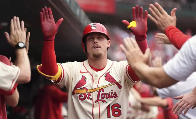St. Louis Cardinals' Nolan Gorman is congratulated by teammates after hitting a two-run home run during the second inning of a baseball game against the Atlanta Braves Saturday, July 12, 2025, in St. Louis. (AP Photo/Jeff Roberson)