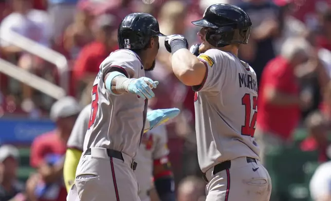 Atlanta Braves' Sean Murphy, right, is congratulated by teammate Ronald Acuna Jr. after hitting a three-run home run during the eighth inning of a baseball game against the St. Louis Cardinals Saturday, July 12, 2025, in St. Louis. (AP Photo/Jeff Roberson)