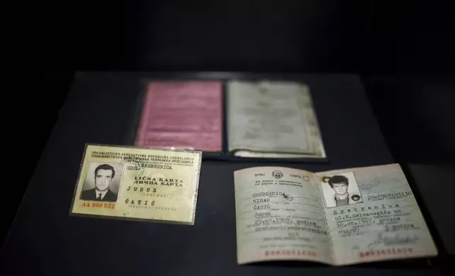 Personal documents found in a mass grave are shown as a part of the exhibition "Lives Beyond the Fields of Death" opened at the Srebrenica Memorial Center in Potocari, Bosnia, Thursday, July 10, 2025. (AP Photo/Armin Durgut)