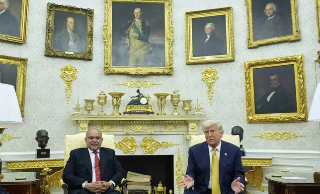 President Donald Trump and Bahrain's Crown Prince Salman bin Hamad Al Khalifa speak in the Oval Office of the White House, Wednesday, July 16, 2025, in Washington. (AP Photo/Alex Brandon)