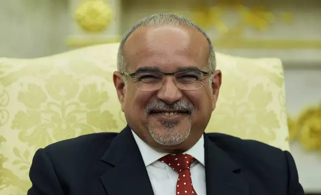 Bahrain's Crown Prince Salman bin Hamad Al Khalifa listens during a meeting with President Donald Trump in the Oval Office of the White House, Wednesday, July 16, 2025, in Washington. (AP Photo/Alex Brandon)
