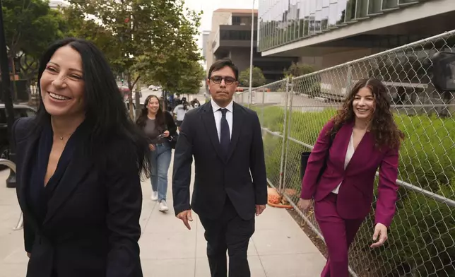 Dr. Salvador Plasencia, center, flanked by his attorneys Debra S. White and Karen L. Goldstein, leaves federal court on Wednesday, July 23, 2025 in Los Angeles, after pleading guilty to giving ketamine to Matthew Perry, leading up to the actor's 2023 overdose death. (AP Photo/Damian Dovarganes)