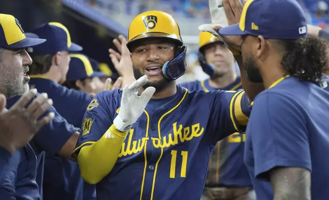 Milwaukee Brewers' Jackson Chourio (11) celebrates his two-run home run during the third inning of a baseball game, Sunday, July 6, 2025, in Miami. (AP Photo/Marta Lavandier)
