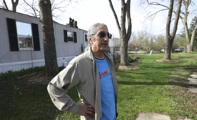 Theo Gantos walks outside his mobile home, Thursday, April 24, 2025, in Mount Morris Township, Mich. (AP Photo/Carlos Osorio)