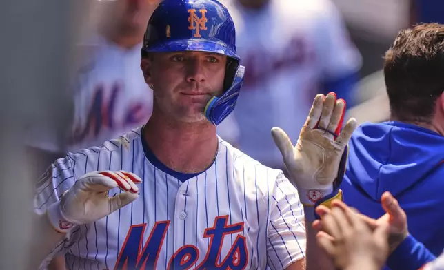 New York Mets' Pete Alonso celebrates with teammates after hitting a three-run home run during the third inning of a baseball game against the Los Angeles Angels Wednesday, July 23, 2025, in New York. (AP Photo/Frank Franklin II)
