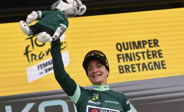 Netherland's Marianne Vos wears the best sprinter jersey on the podium after the second stage of the Women¥s Tour de France cycling race that starts in Brest to finish in Quimper, Sunday, July 27, 2025 in Quimper, Brittany, western France. (AP Photo/Mathieu Pattier)