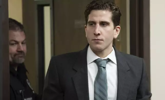 FILE - Bryan Kohberger, the man accused of fatally stabbing four University of Idaho students, is escorted into court for a hearing in Latah County District Court, Sept. 13, 2023, in Moscow, Idaho. (AP Photo/Ted S. Warren, Pool, File)