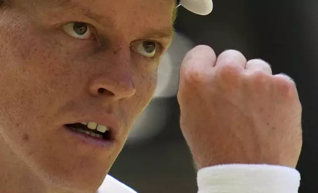 Italy's Jannik Sinner reacts after winning a point against Carlos Alcaraz of Spain in the men's singles final at the Wimbledon Tennis Championships in London, Sunday, July 13, 2025. (AP Photo/Kin Cheung)
