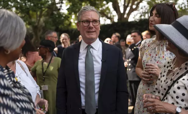 Britain's Prime Minister Keir Starmer hosts a reception for public sector workers at 10 Downing Street, London, Tuesday July 1, 2025. (Carl Court/Pool via AP)