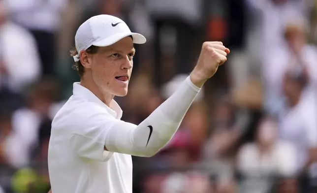 Jannik Sinner of Italy celebrates winning the men's singles quarter final match against Ben Shelton of the U.S. at the Wimbledon Tennis Championships in London, Wednesday, July 9, 2025.(AP Photo/Kirsty Wigglesworth)