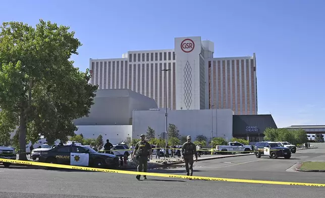 Police respond to a shooting outside the Grand Sierra Resort in Reno, Nev., Monday, July 28, 2025. (AP Photo/Andy Barron)