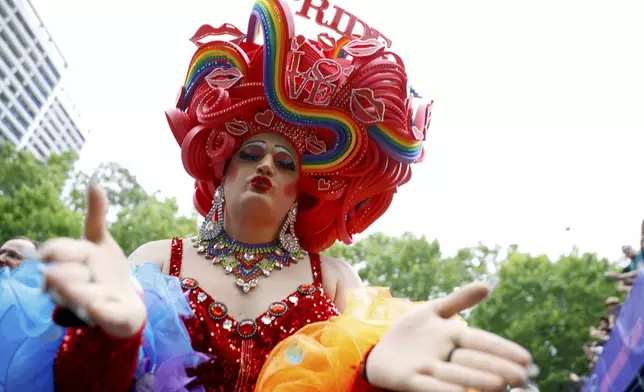 Participants in the 47th Berlin Pride, the Christopher Street Day (CSD) demonstration, gather before the start of the parade, in Berlin, Saturday, July 26, 2025. (Casten Koall/dpa va AP)