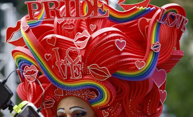 Participants in the 47th Berlin Pride, the Christopher Street Day (CSD) demonstration, gather before the start of the parade, in Berlin, Saturday, July 26, 2025. (Casten Koall/dpa va AP)