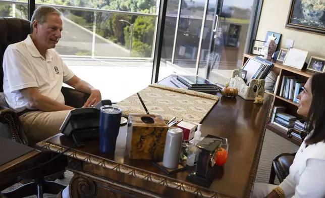President of Samueli Family Philanthropies Lindsey Spindle speaks with cofounder Henry Samueli at the foundation's offices in Corona Del Mar, Calif., Monday, July 7, 2025. (AP Photo/Zoë Meyers)